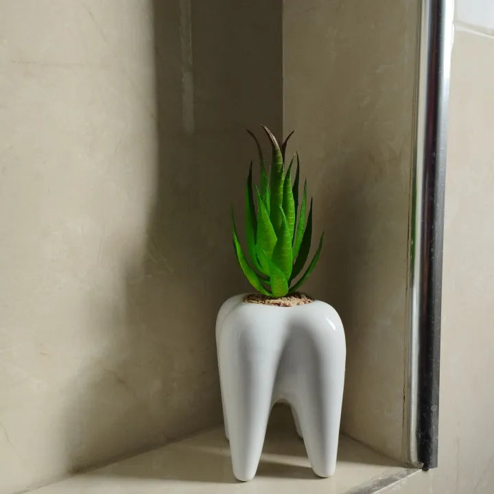 Tooth ceramic pot with artificial plant